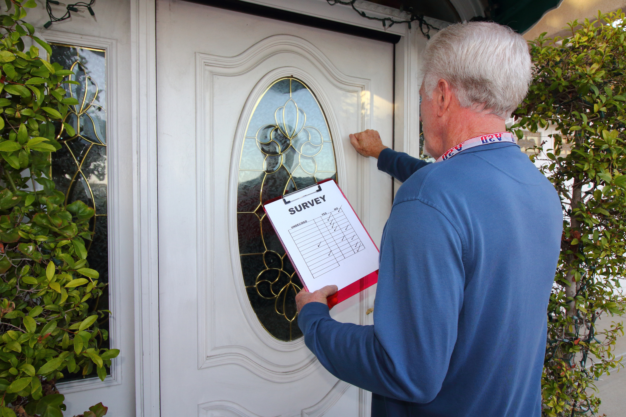 Man Canvassing Door to Door for a Survey